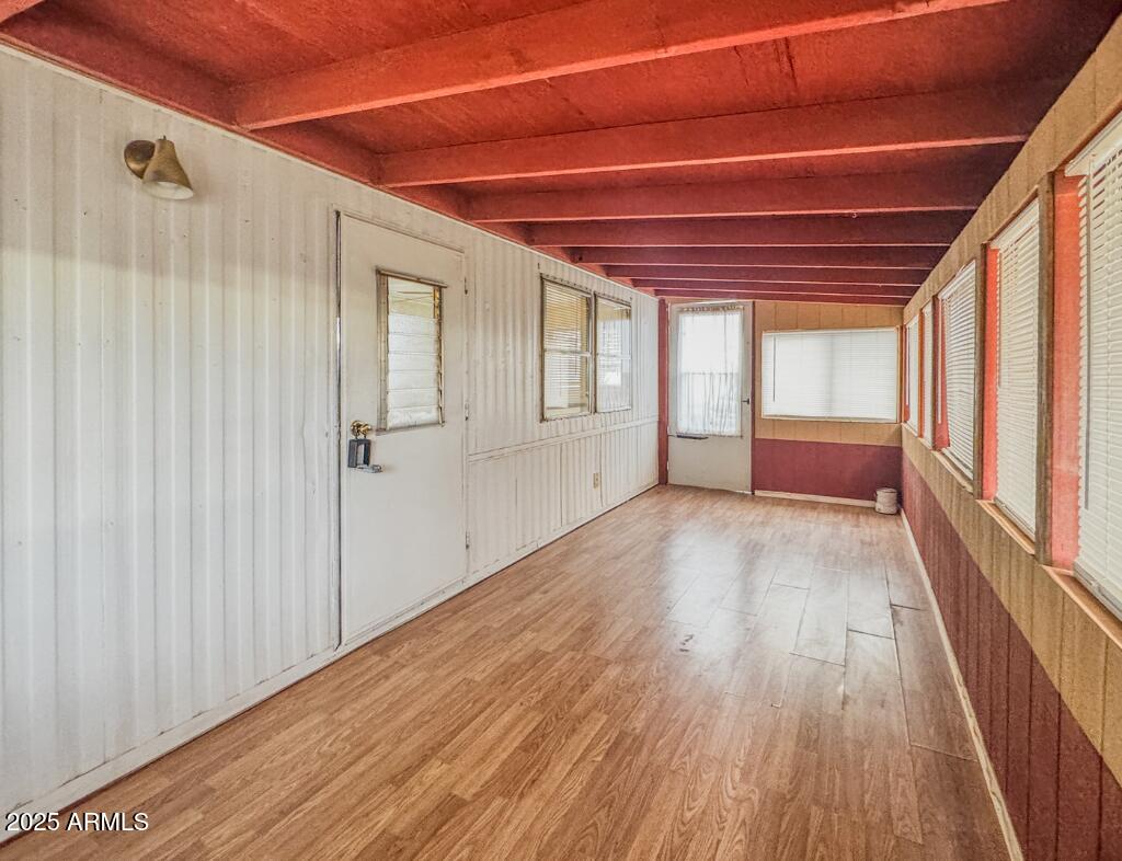 11100 West Alsdorf Road, Unit 10 Arizona City, AZ 85123 - Photo 7 of 19 a view of empty room with wooden floor and fan