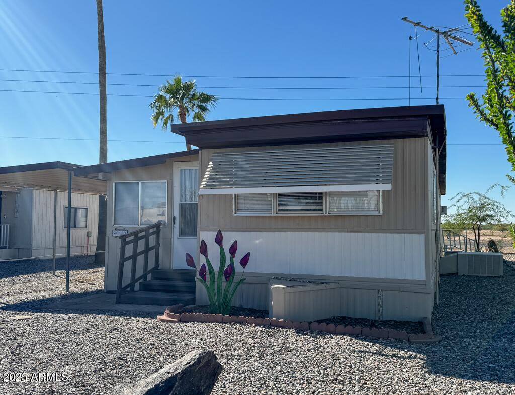 11100 West Alsdorf Road, Unit 10 Arizona City, AZ 85123 - Photo 9 of 19 a potted plant sitting in front of a house