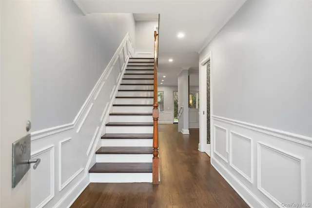 a view of entryway with wooden floor