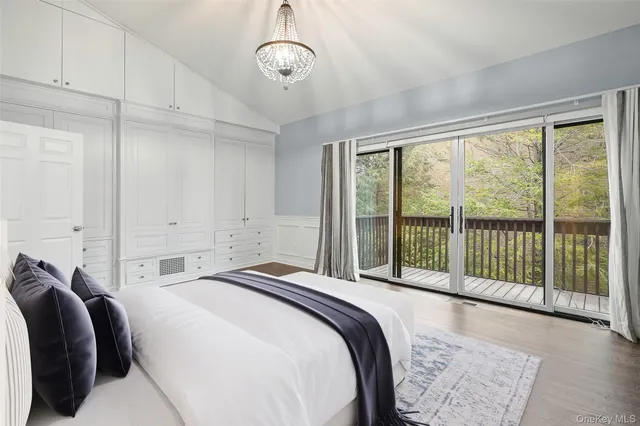 a bed room with a bed and a large window