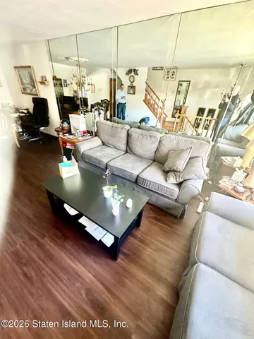 a living room with furniture and rug