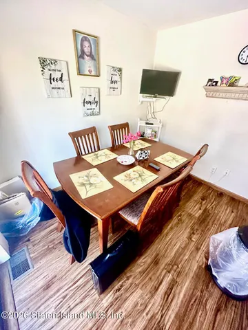 a bedroom with furniture and a chandelier