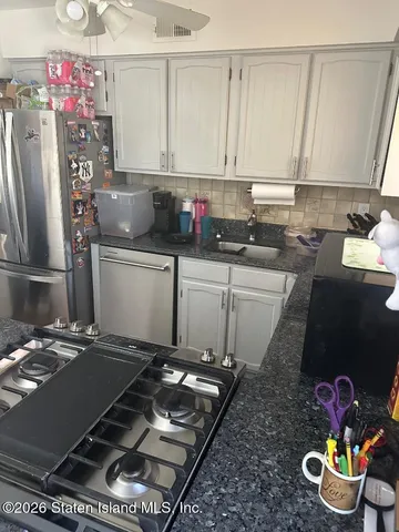 a bathroom with a toilet a sink and a shower