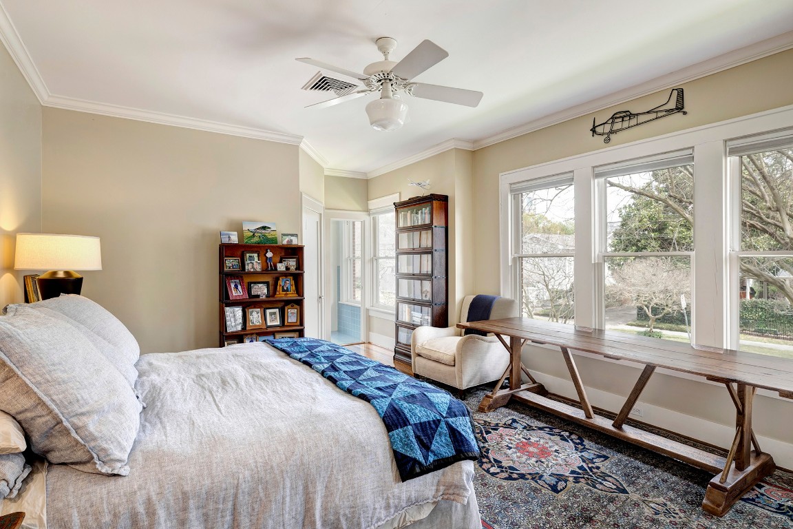 1902 Bolsover Street Houston, TX 77005 - Photo 14 of 27 Large windows fill the primary bedroom with natural light and overlook the side yard and neighborhood.