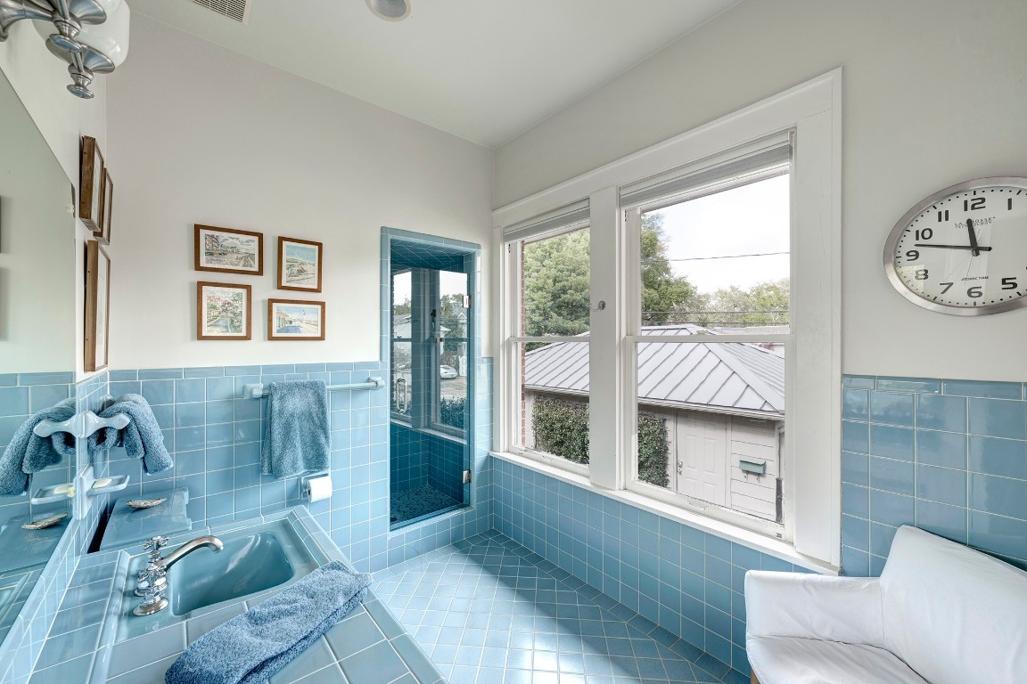 1902 Bolsover Street Houston, TX 77005 - Photo 16 of 27 Vintage tile adds character to the walk-in shower in the primary bath.