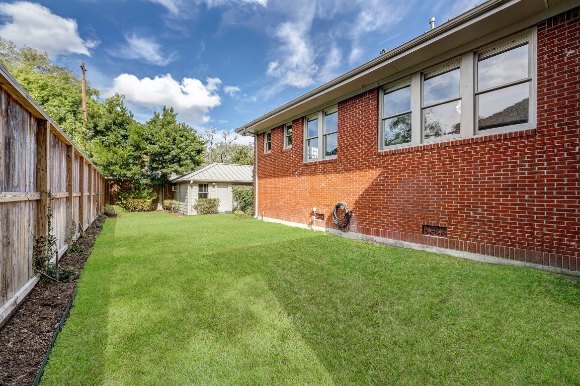 1902 Bolsover Street Houston, TX 77005 - Photo 24 of 27 Looking across the large yard toward the detached 2-car garage.