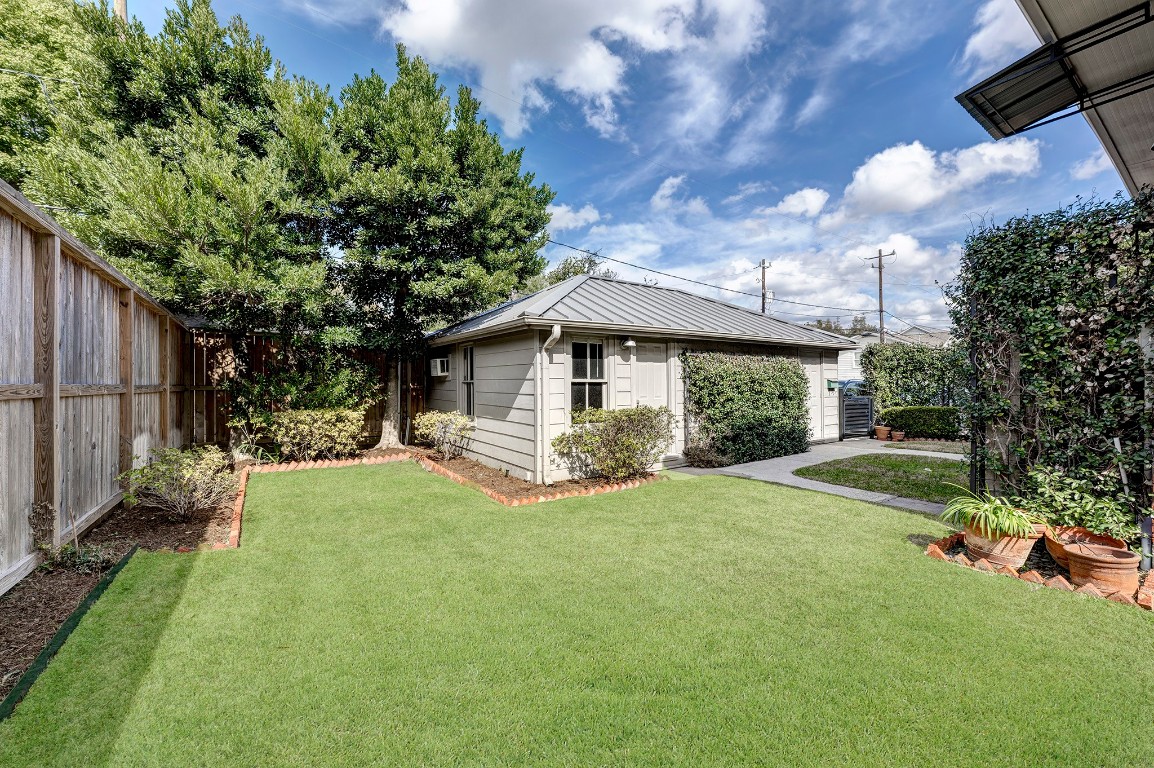 1902 Bolsover Street Houston, TX 77005 - Photo 25 of 27 2-car detached garage and house both have metal seam roofs.
