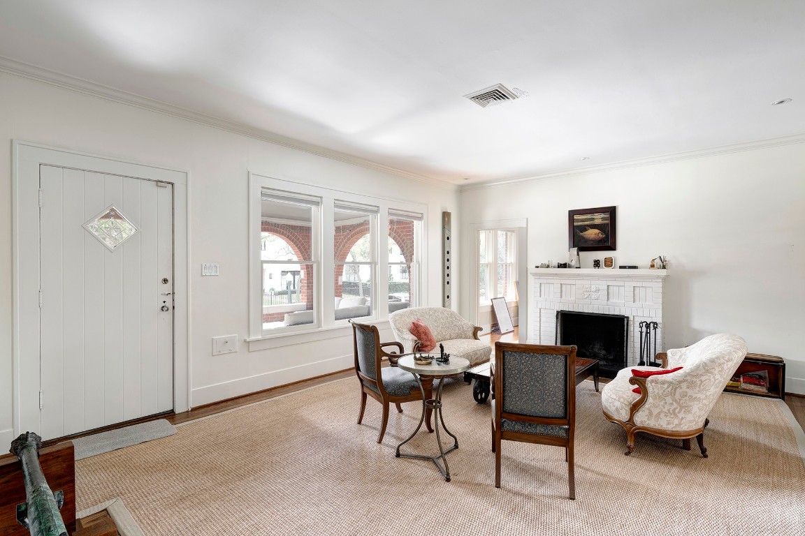 1902 Bolsover Street Houston, TX 77005 - Photo 3 of 27 Front door opens to a spacious and light-filled living room with a fireplace and gorgeous wood floors.