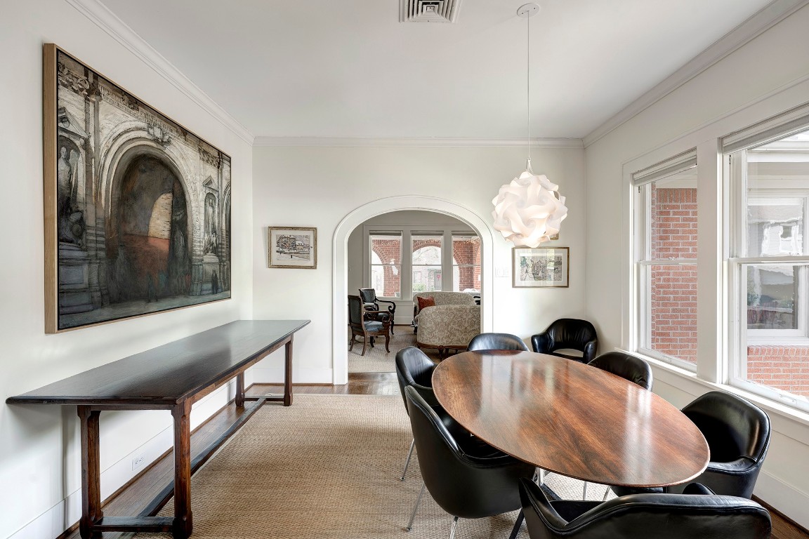 1902 Bolsover Street Houston, TX 77005 - Photo 5 of 27 Wood floors and a modern light fixture highlight the dining room.
