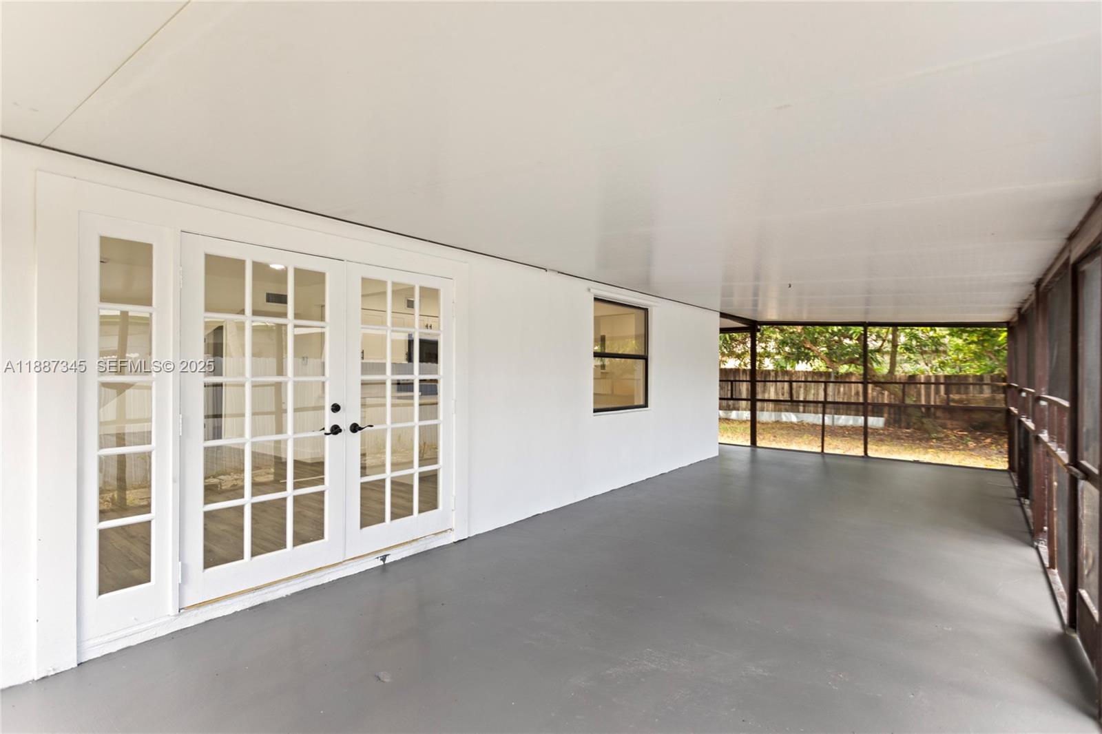 11301 Southwest 177th Street Miami, FL 33157 - Photo 19 of 31 a view of an empty room with a large window