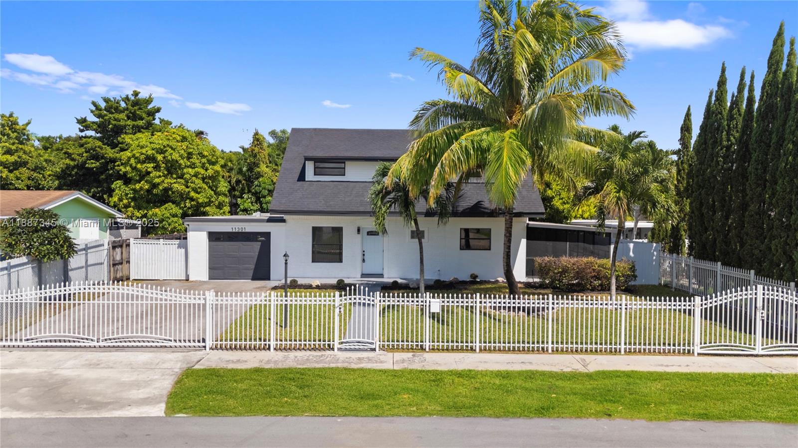11301 Southwest 177th Street Miami, FL 33157 - Photo 2 of 31 a house view with a garden space