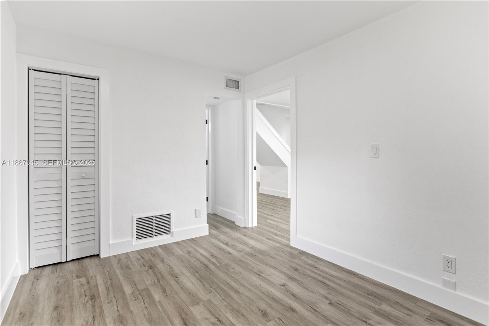 11301 Southwest 177th Street Miami, FL 33157 - Photo 21 of 31 a view of empty room with wooden floor