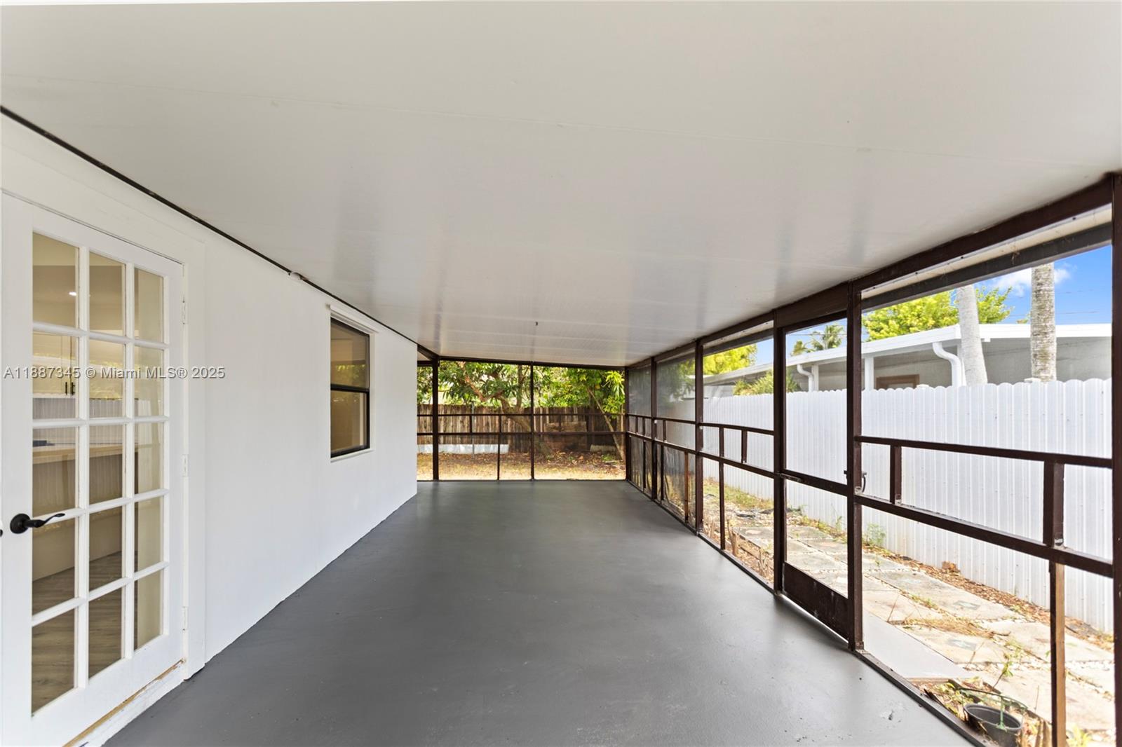 11301 Southwest 177th Street Miami, FL 33157 - Photo 27 of 31 a view of an empty room with windows