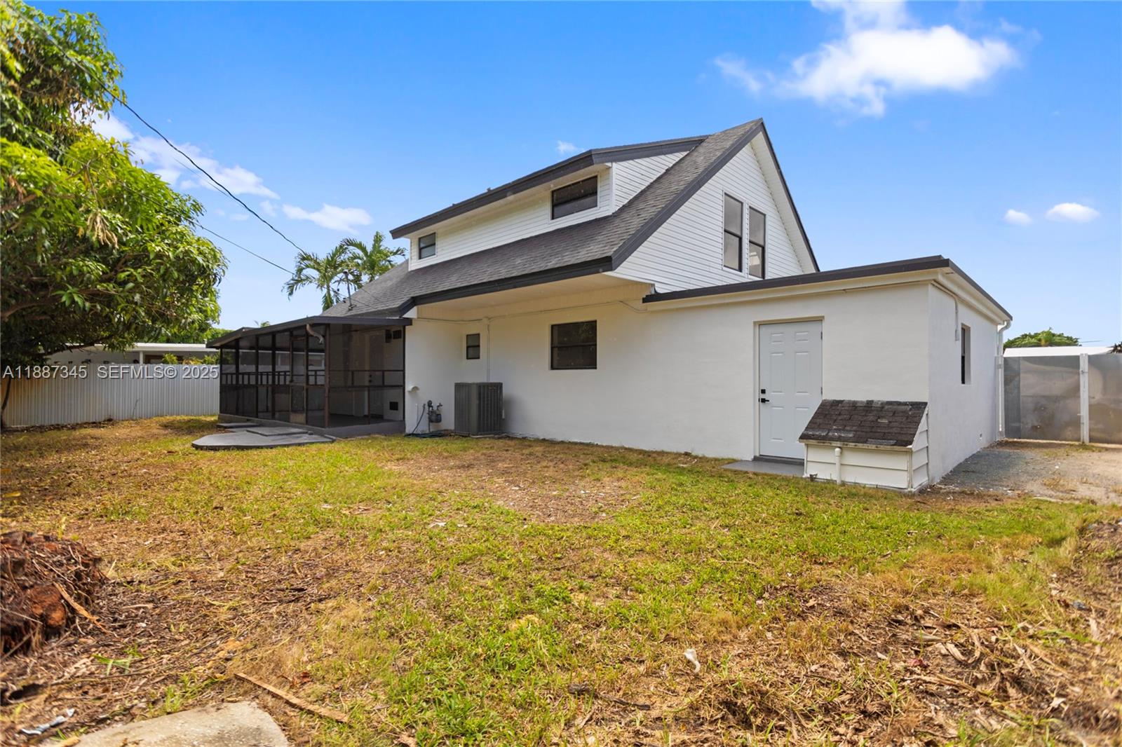 11301 Southwest 177th Street Miami, FL 33157 - Photo 28 of 31 a view of house with backyard and garage