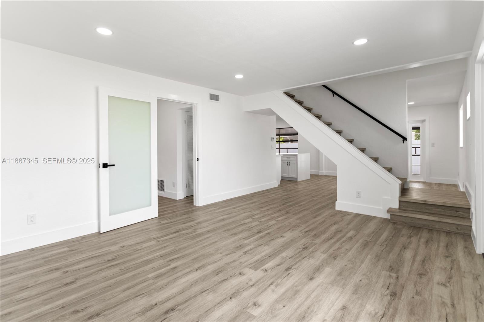 11301 Southwest 177th Street Miami, FL 33157 - Photo 6 of 31 wooden floor in an empty room with wooden floor