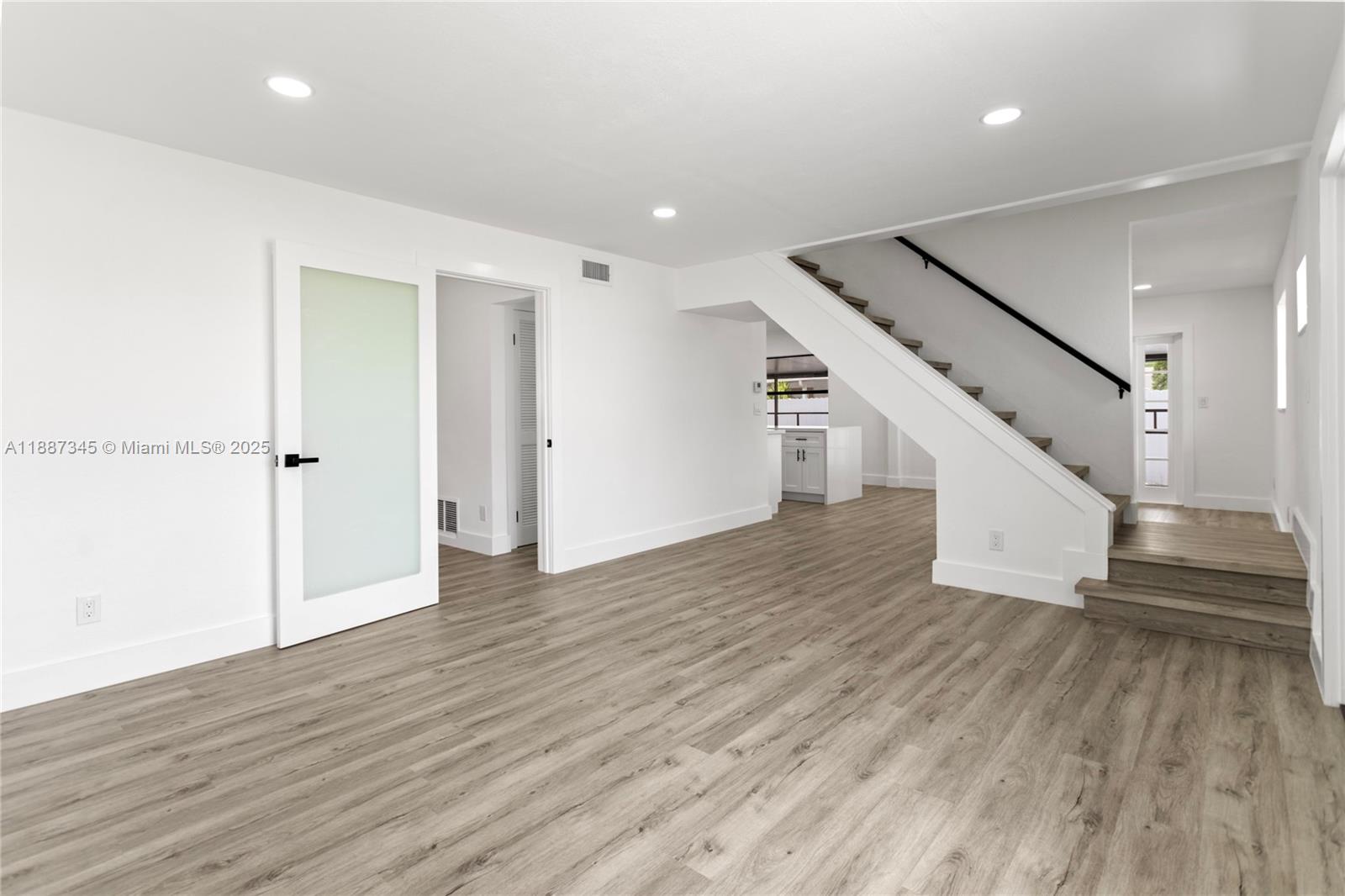 11301 Southwest 177th Street Miami, FL 33157 - Photo 6 of 31 wooden floor in an empty room with wooden floor