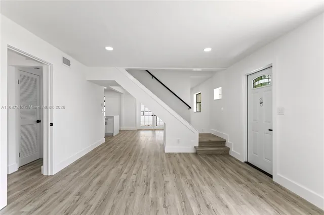 a view of entryway with wooden floor