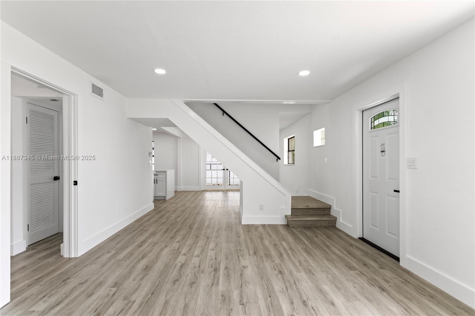 11301 Southwest 177th Street Miami, FL 33157 - Photo 7 of 31 a view of entryway with wooden floor