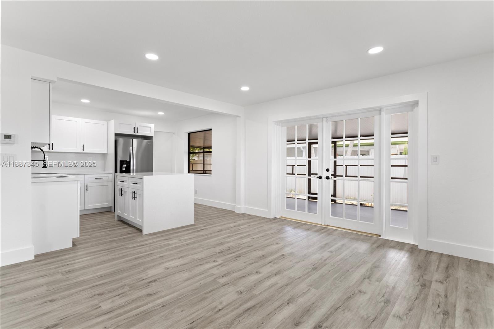 11301 Southwest 177th Street Miami, FL 33157 - Photo 9 of 31 a view of a kitchen with wooden floor and electronic appliances