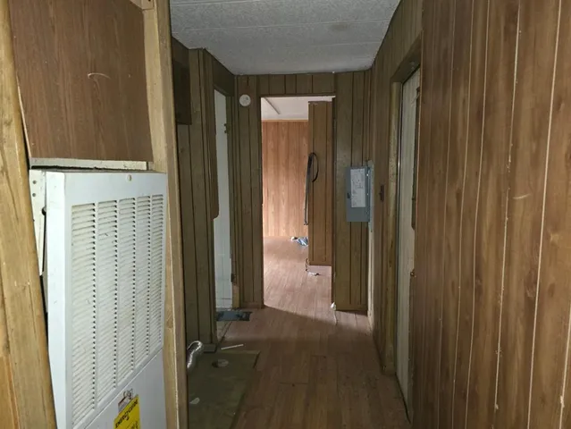 a view of a bathroom with shower and a tub