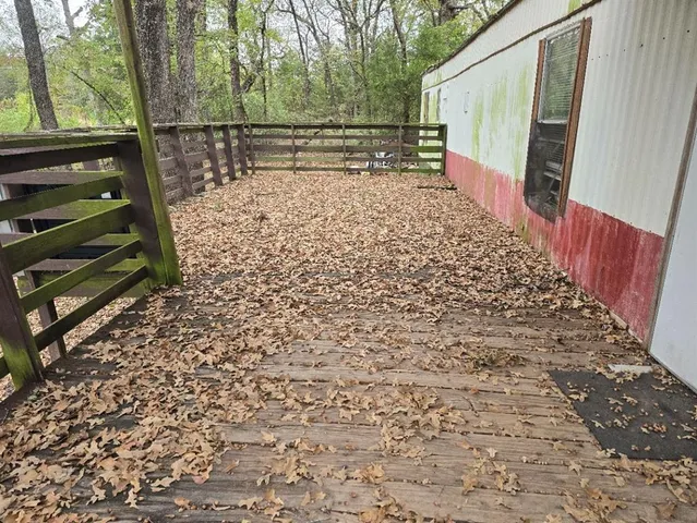 a view of small space with wooden fence