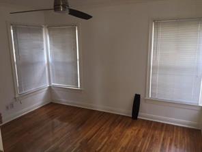 2104 Enfield Road, Unit D Austin, TX 78703 - Photo 12 of 14 Unfurnished room featuring ceiling fan and dark wood-style floors