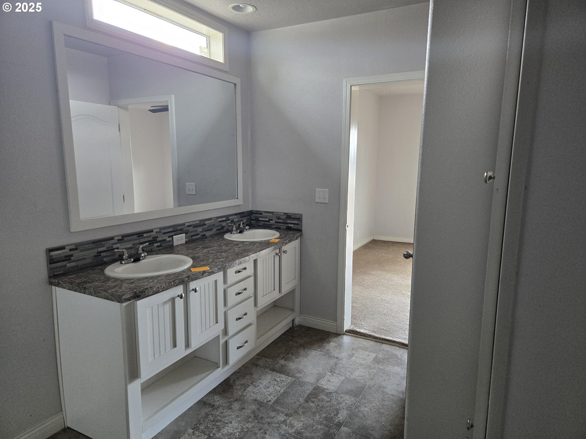 9290 Southwest 3115th Road Culver, OR 97734 - Photo 10 of 21 a view of a bathroom with a sink and a mirror
