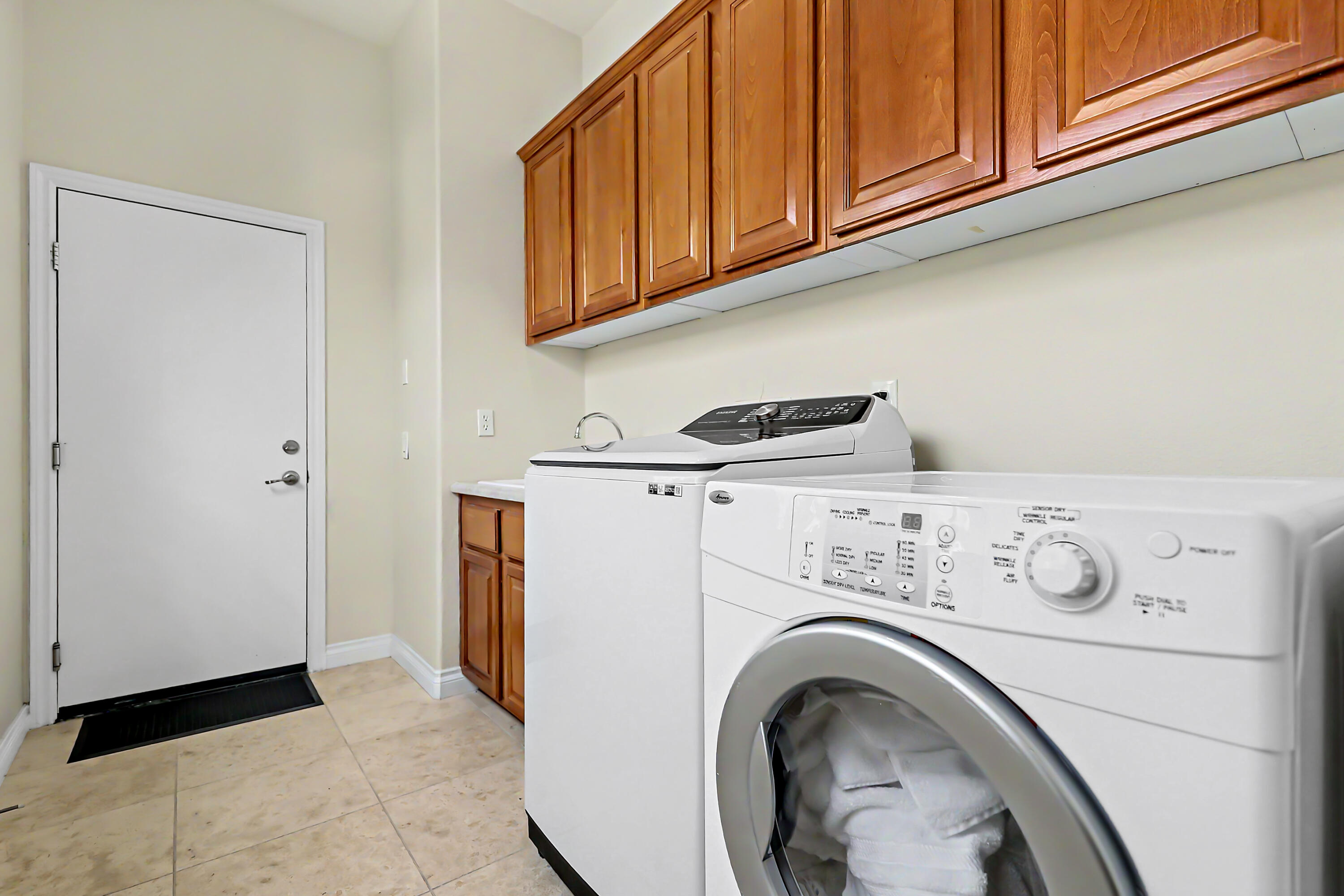 54048 Riviera La Quinta, CA 92253 - Photo 25 of 39 a utility room with dryer and washer