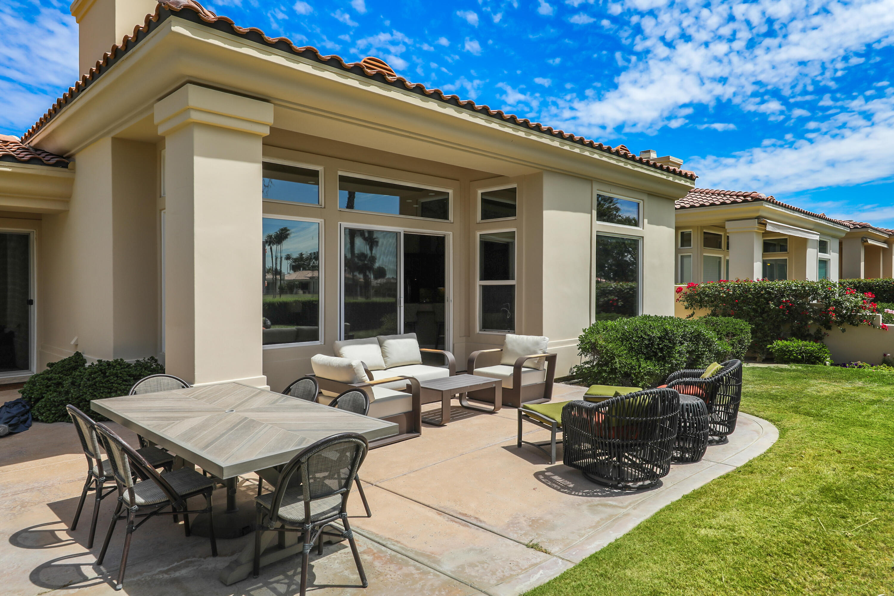 54048 Riviera La Quinta, CA 92253 - Photo 32 of 39 a view of a house with backyard sitting area and garden