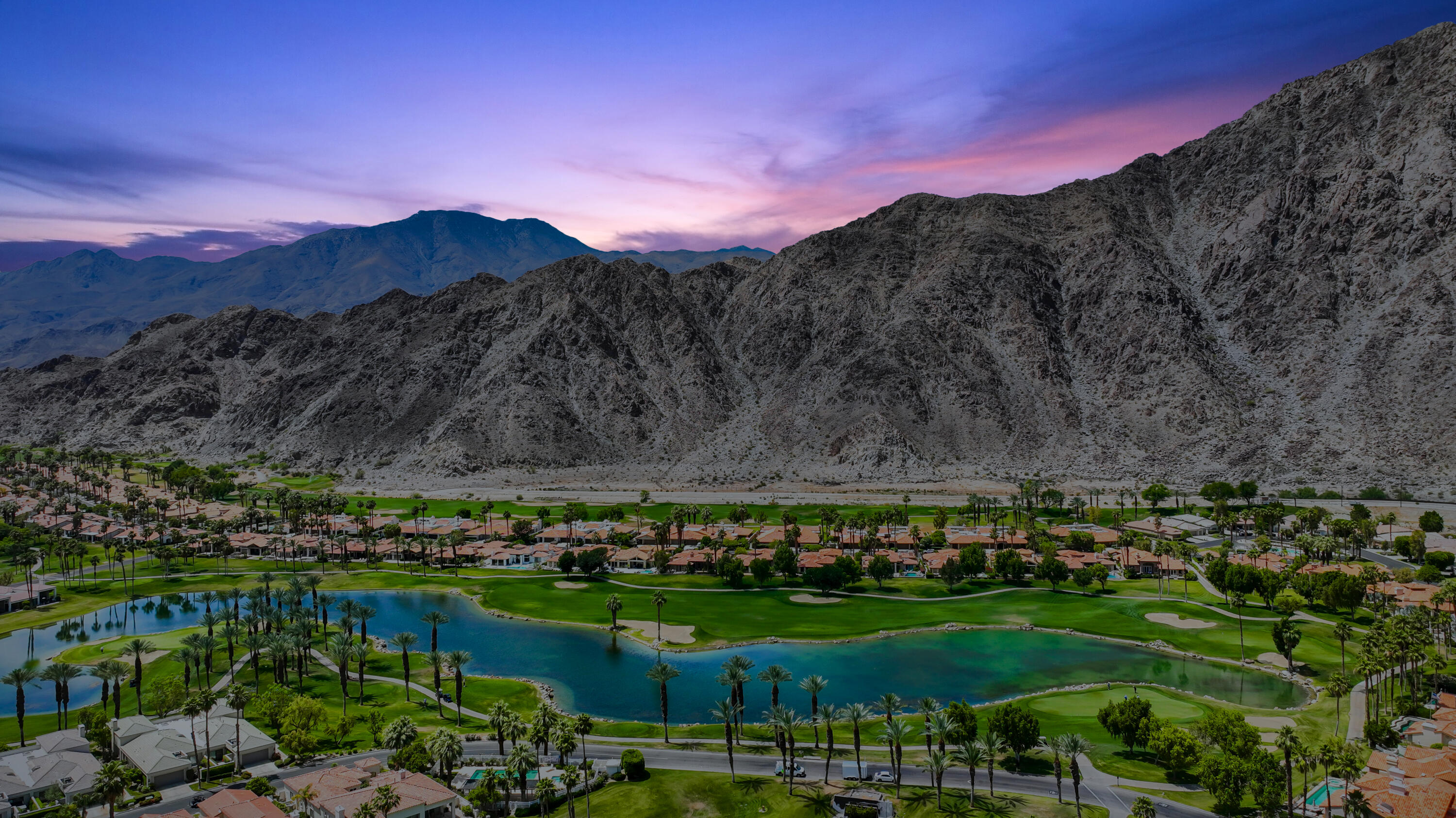 54048 Riviera La Quinta, CA 92253 - Photo 38 of 39 a view of a lake with a mountain in the background