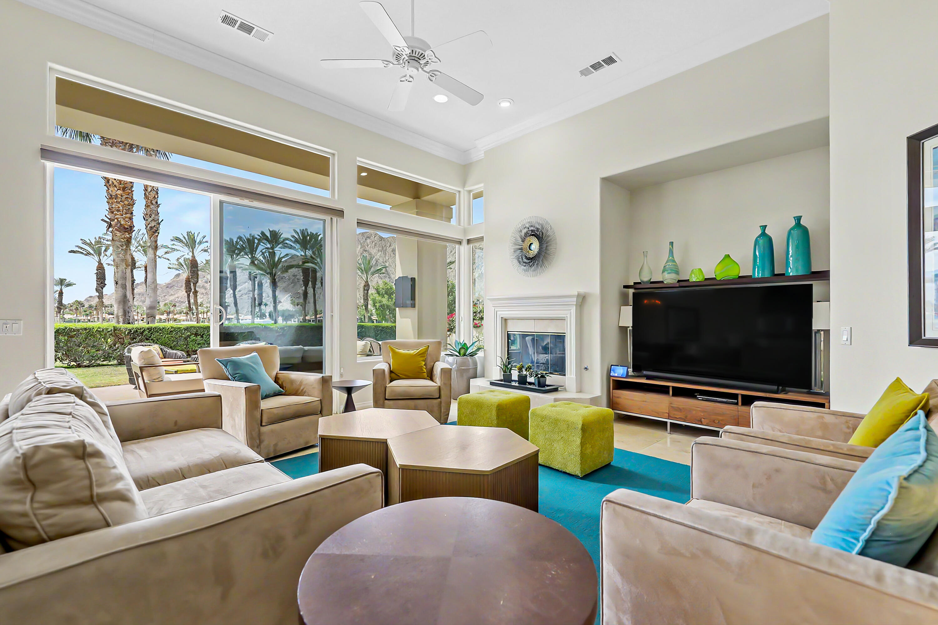 54048 Riviera La Quinta, CA 92253 - Photo 7 of 39 a living room with furniture and a flat screen tv