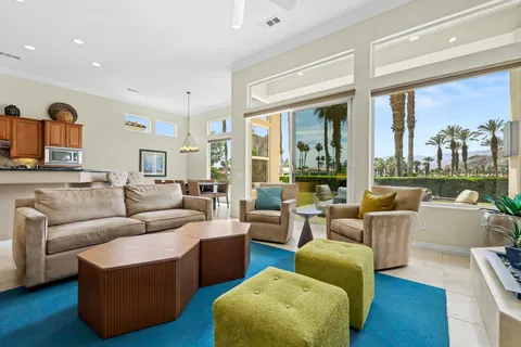 a kitchen with stainless steel appliances granite countertop a refrigerator a stove and a sink