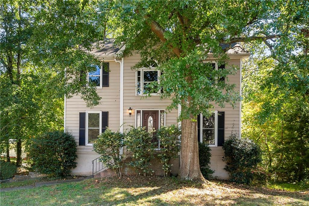 4995 Brown Road Powder Springs, GA 30127 - Photo 1 of 1 a front view of a house with garden