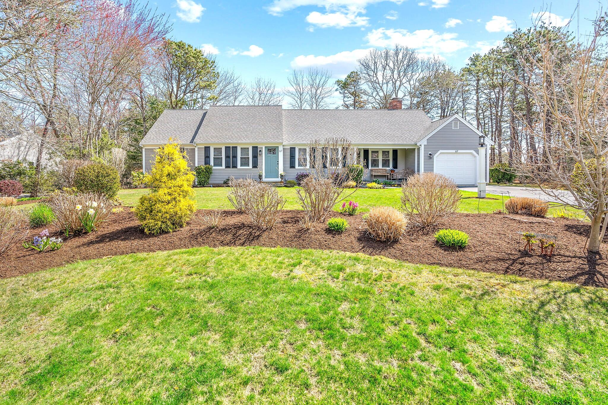 a front view of house with yard and seating area