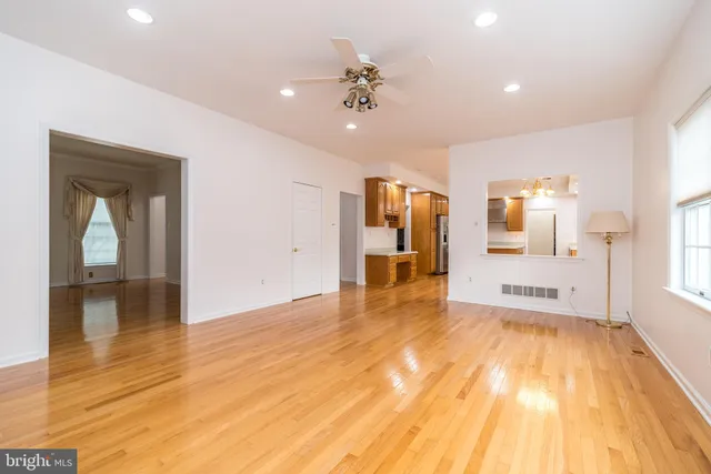 a kitchen with stainless steel appliances granite countertop a refrigerator a sink and a stove