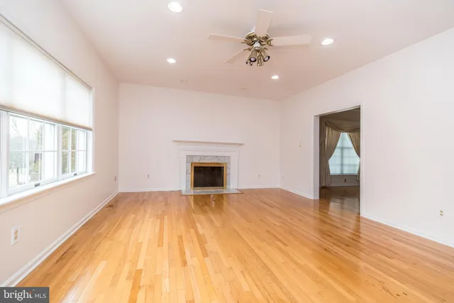 a kitchen with stainless steel appliances granite countertop a sink a stove counter space and cabinets