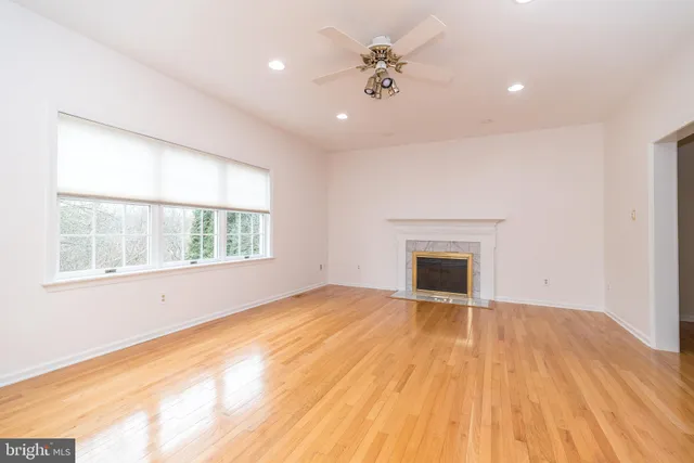 a kitchen with stainless steel appliances granite countertop a sink dishwasher and cabinets with wooden floor
