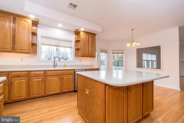 a view of a field with trees in the background