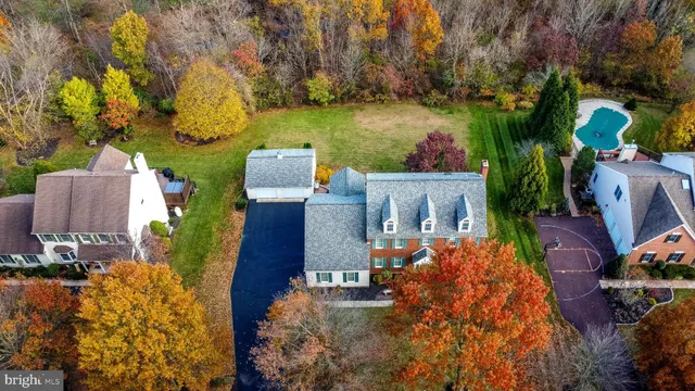 an aerial view of houses with outdoor space
