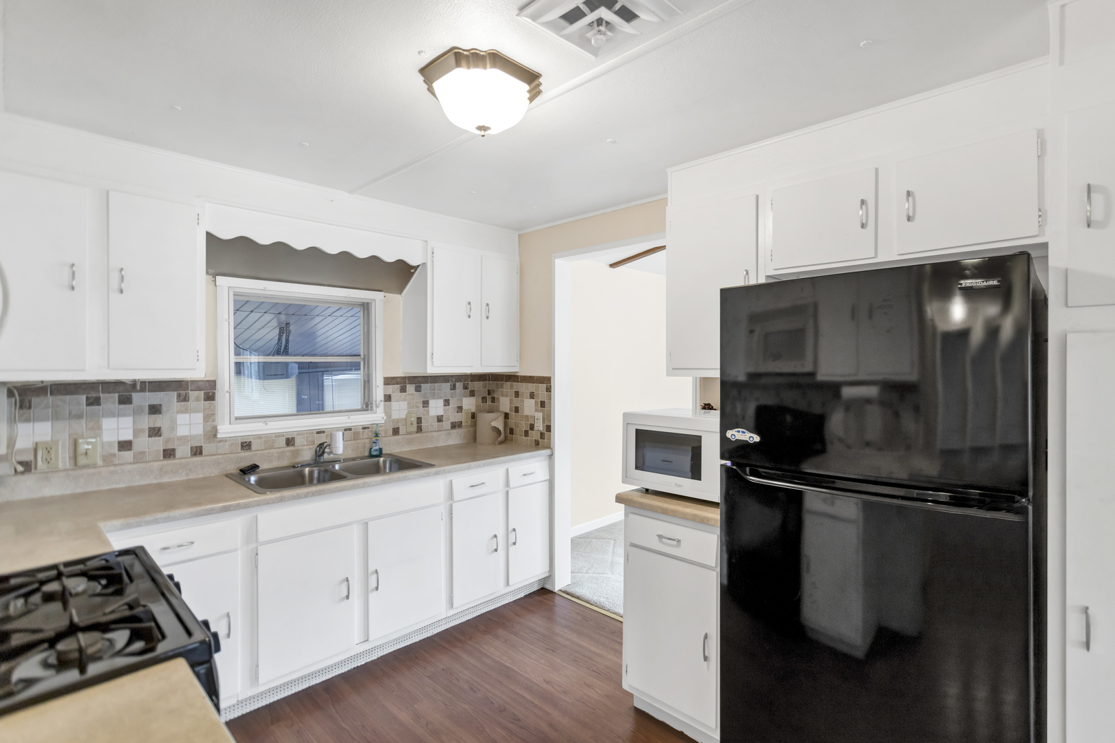 1053 Lakeview Road Elgin, IL 60123 - Photo 12 of 33 a kitchen with a sink appliances and cabinets