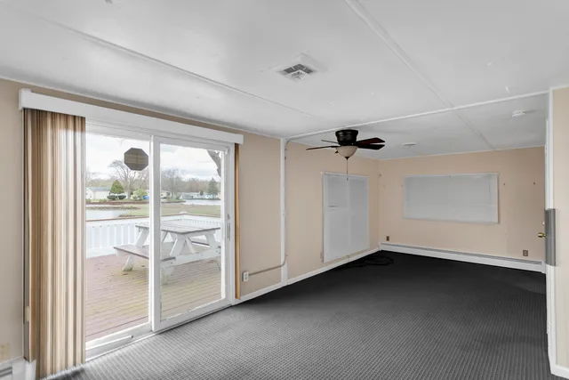 a view of empty room with windows