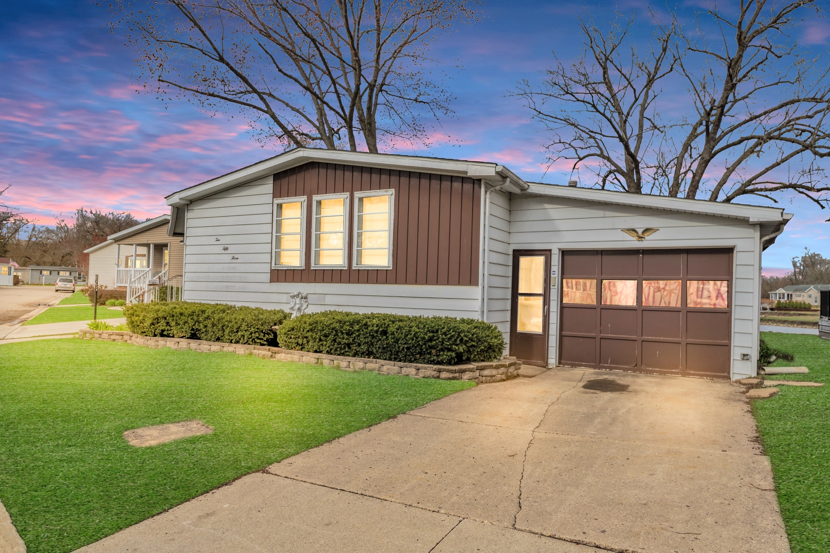 1053 Lakeview Road Elgin, IL 60123 - Photo 2 of 33 a front view of a house with a yard and potted plants