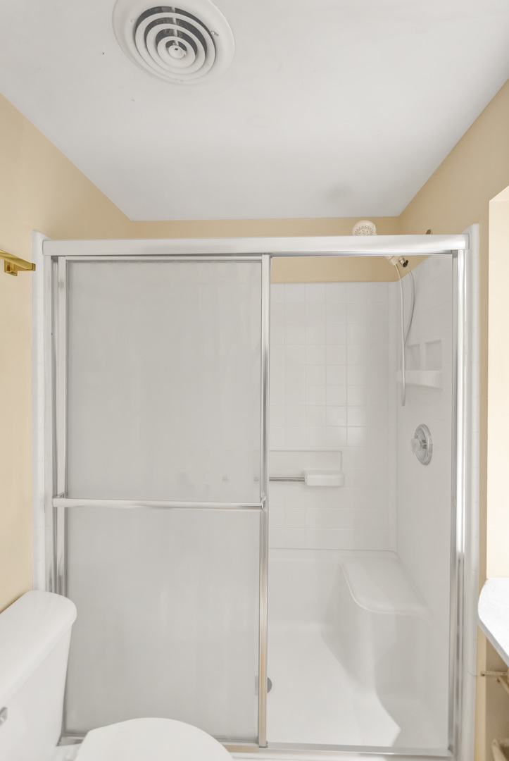 1053 Lakeview Road Elgin, IL 60123 - Photo 23 of 33 a bathroom with a shower and a toilet