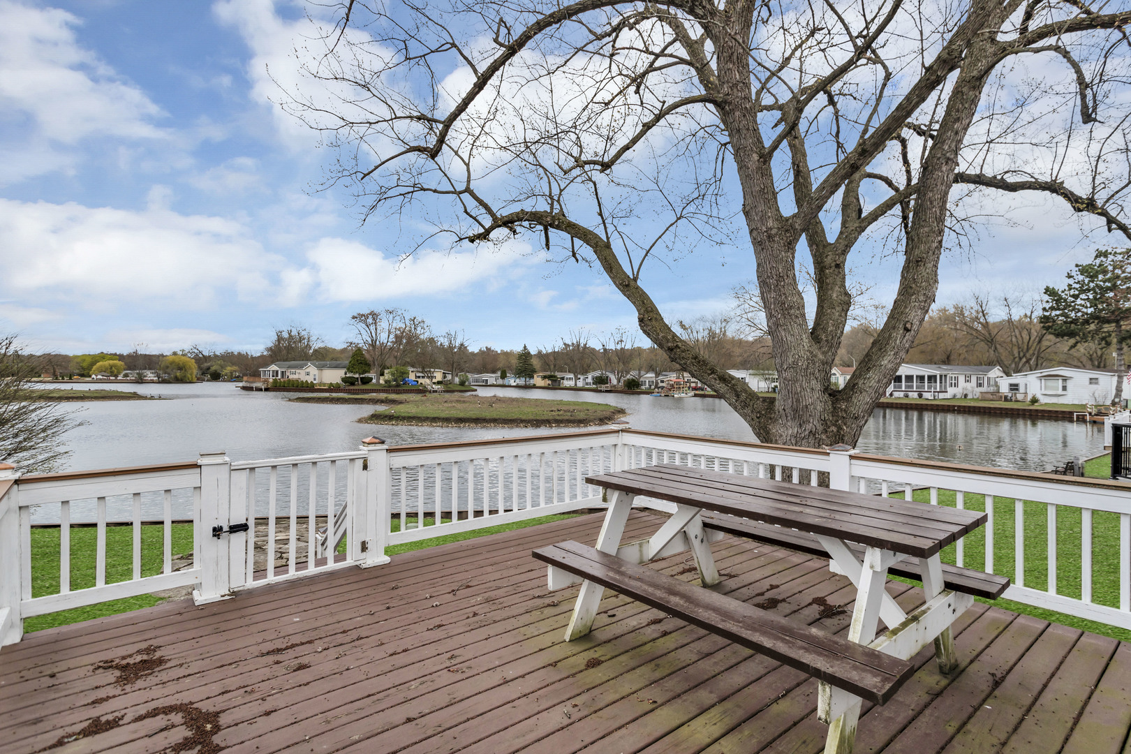 1053 Lakeview Road Elgin, IL 60123 - Photo 28 of 33 a view of a roof deck with wooden floor and fence