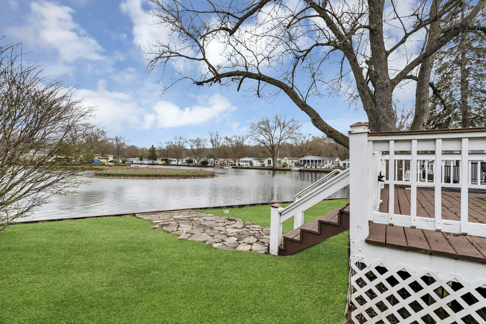 1053 Lakeview Road Elgin, IL 60123 - Photo 31 of 33 a view of a house with a yard and a large tree