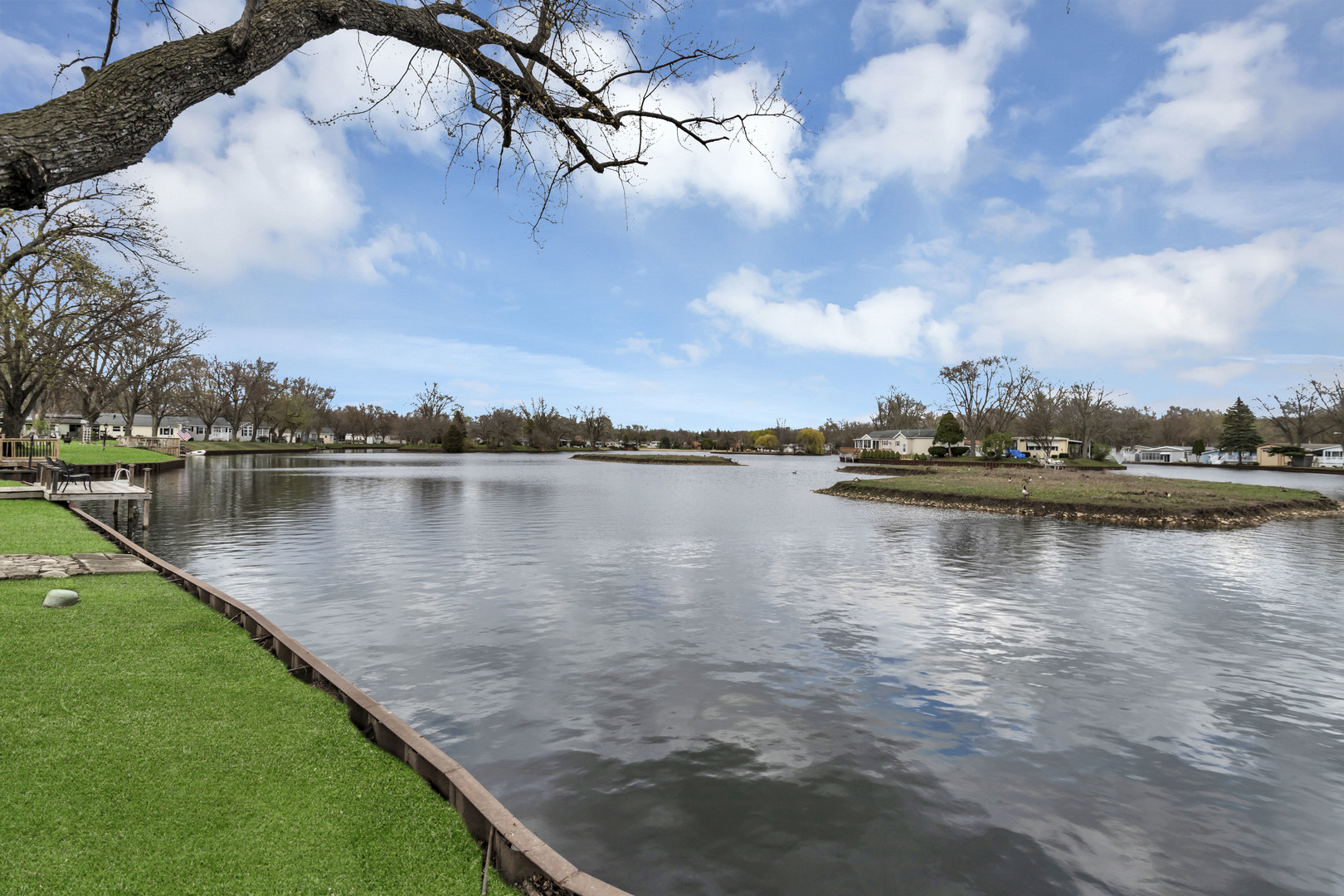1053 Lakeview Road Elgin, IL 60123 - Photo 32 of 33 a view of a lake with houses in the back