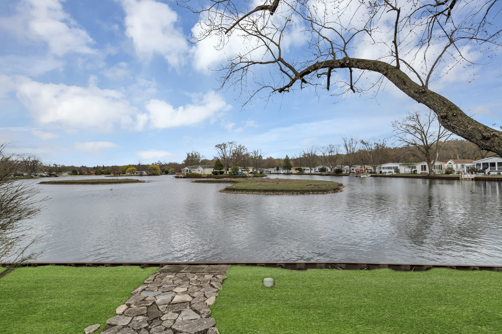 1053 Lakeview Road Elgin, IL 60123 - Photo 33 of 33 a view of a lake with a house in the background