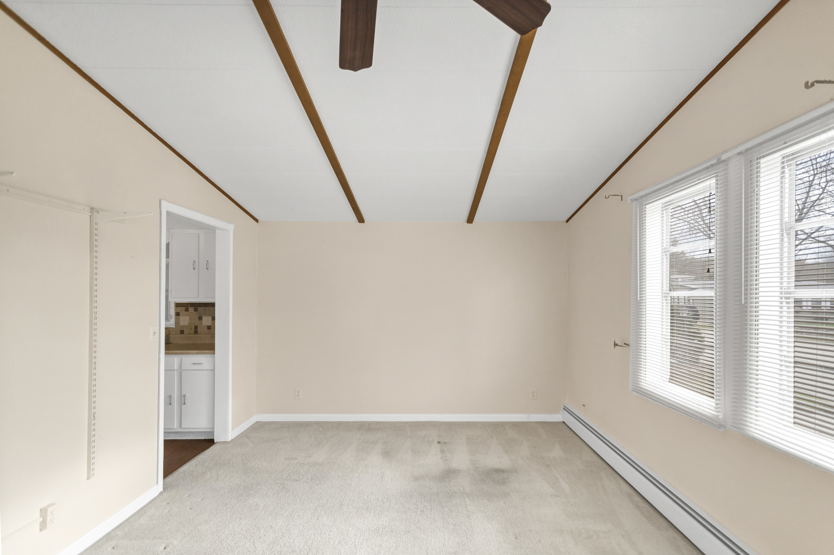 1053 Lakeview Road Elgin, IL 60123 - Photo 8 of 33 a view of an empty room with windows