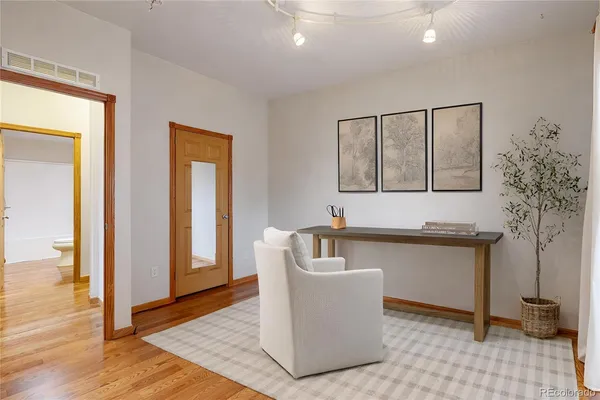 a living room with granite countertop furniture and a fireplace