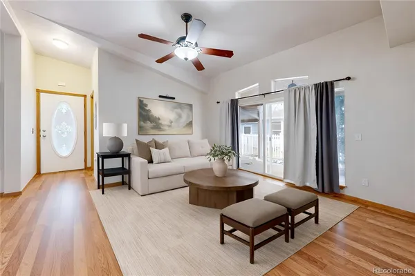 a living room with furniture and a large window